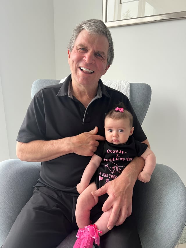Dr. Roy Jackson spending time with his granddaughter, Bella.