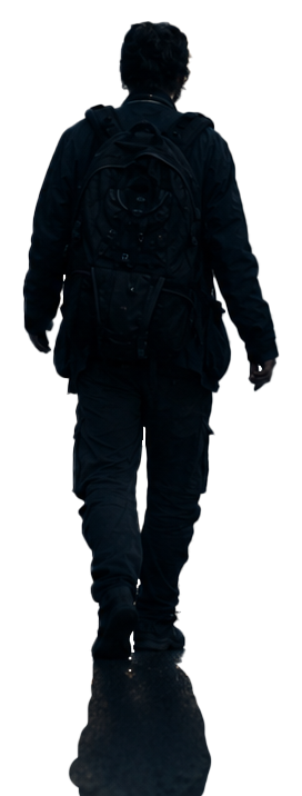 Un homme vu de dos marche dans une rue de Paris.