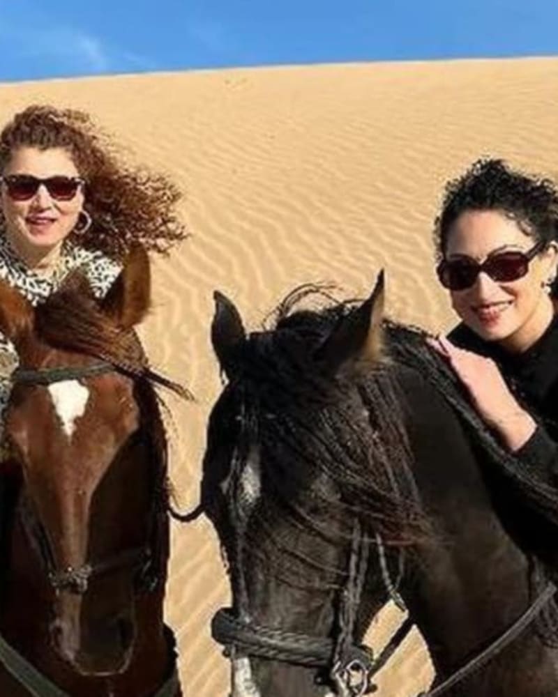 Professional horse riding guide with traditional Moroccan attire