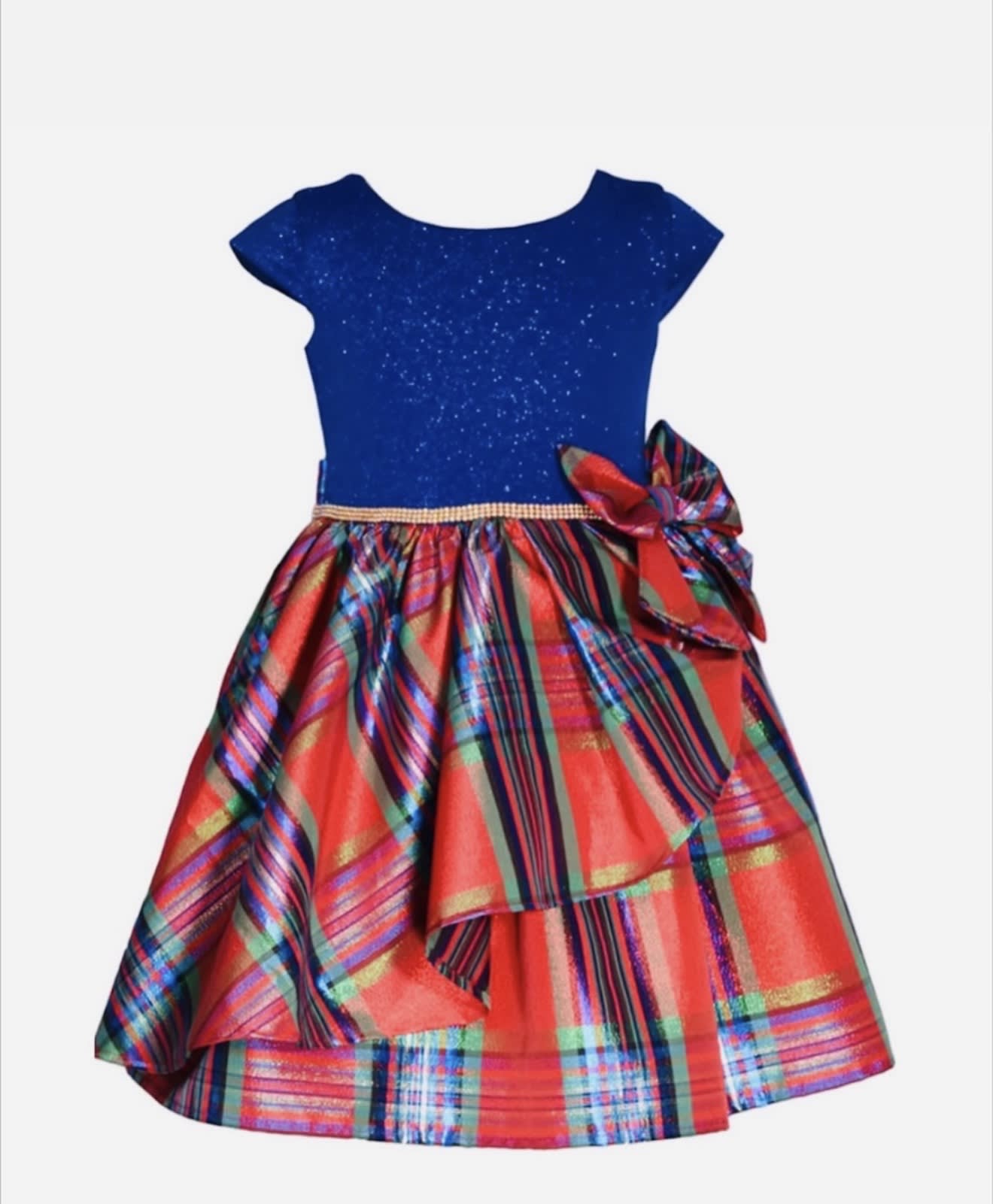 Sparkly bodice, statement side bow and twirl ready plaid skirt