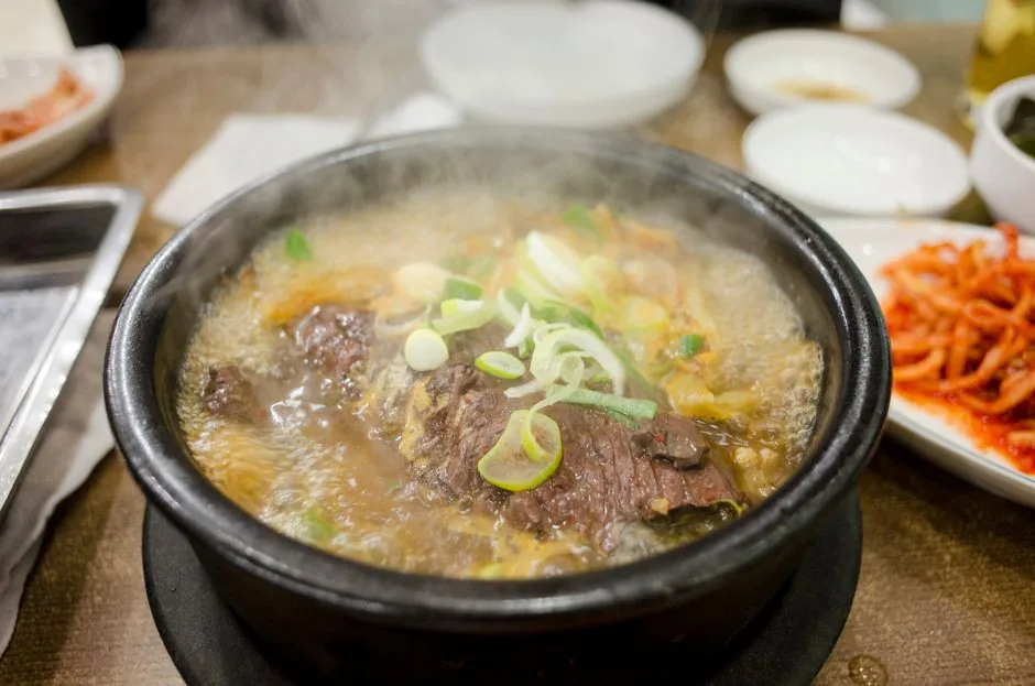 A bubbling Korean stew served with rice and side dishes