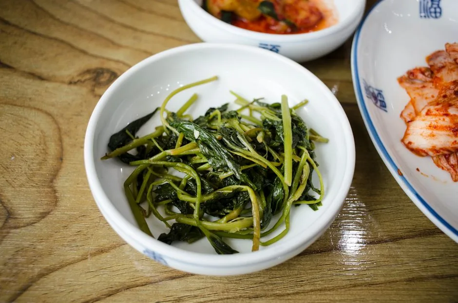 A Korean restaurant table set with a main dish and side dishes