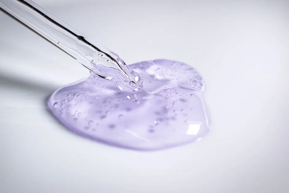 A serum dropper bottle with product texture