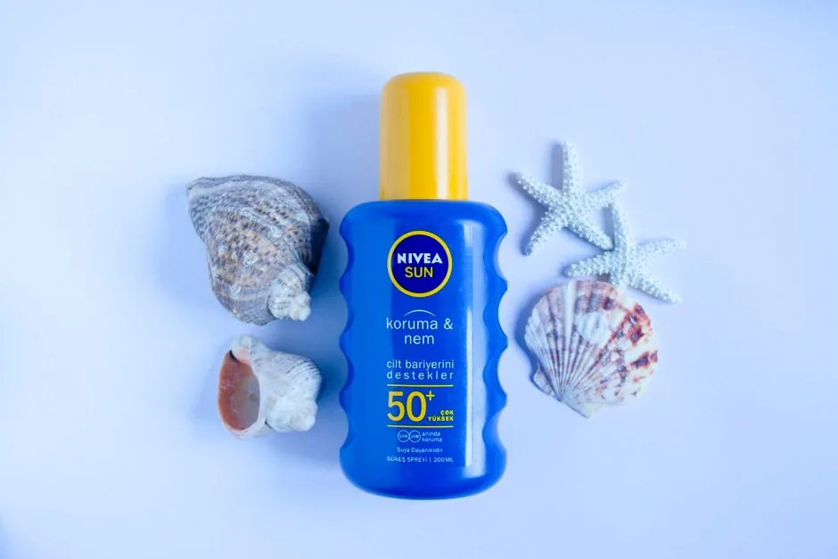 A sunscreen bottle and a swatch of cream