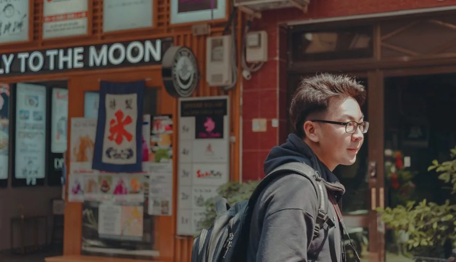 A traveler checking phrases on a Seoul street