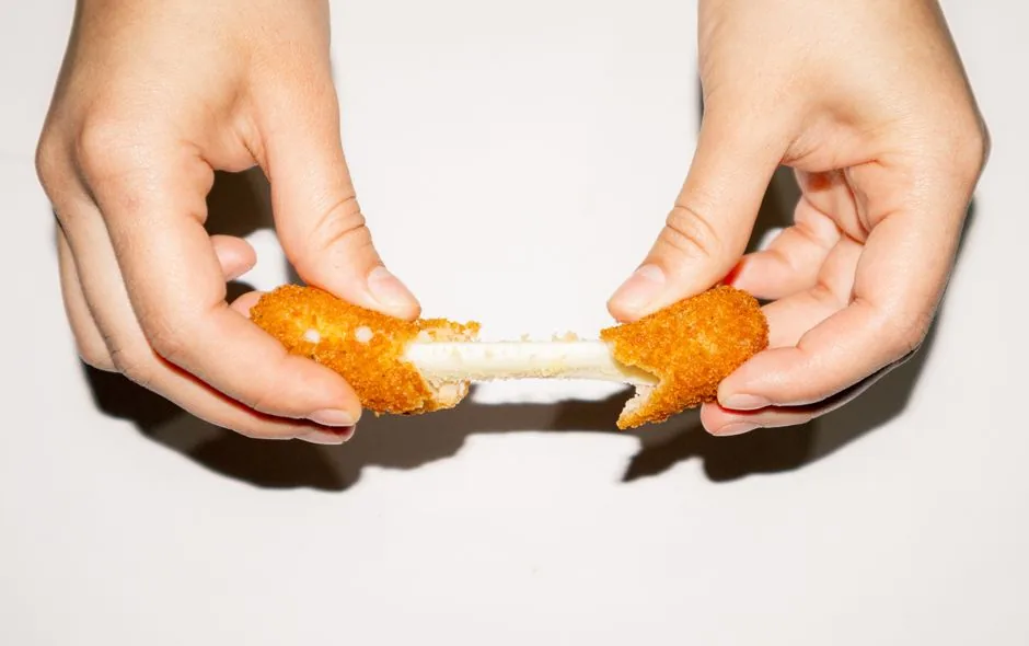 A Korean corn dog with a mozzarella cheese pull