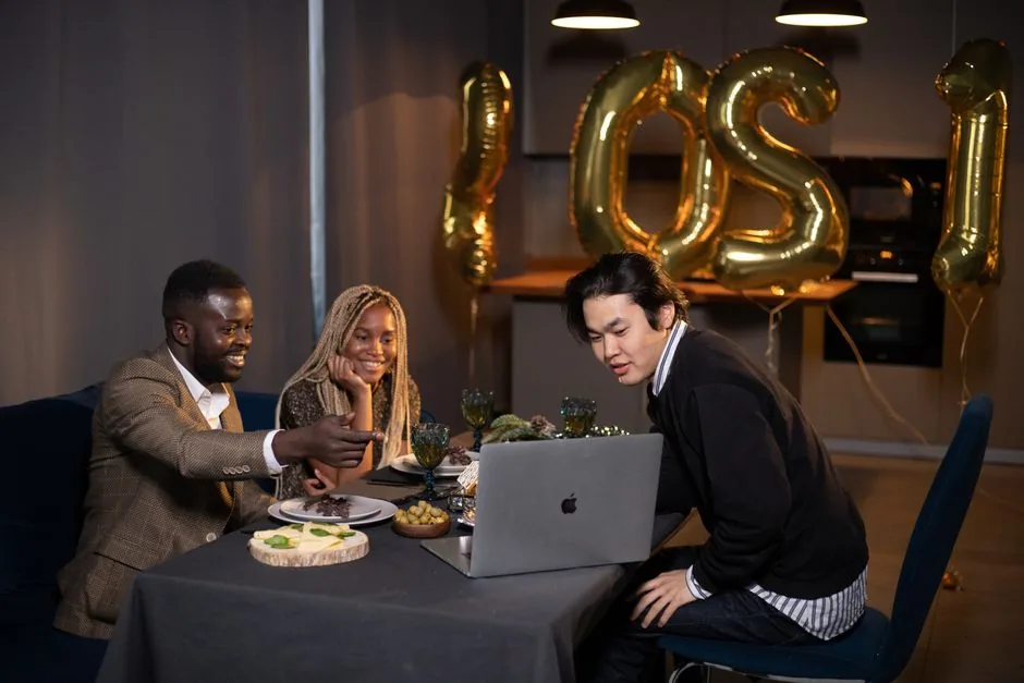 A group at a dinner table, attentive to each other