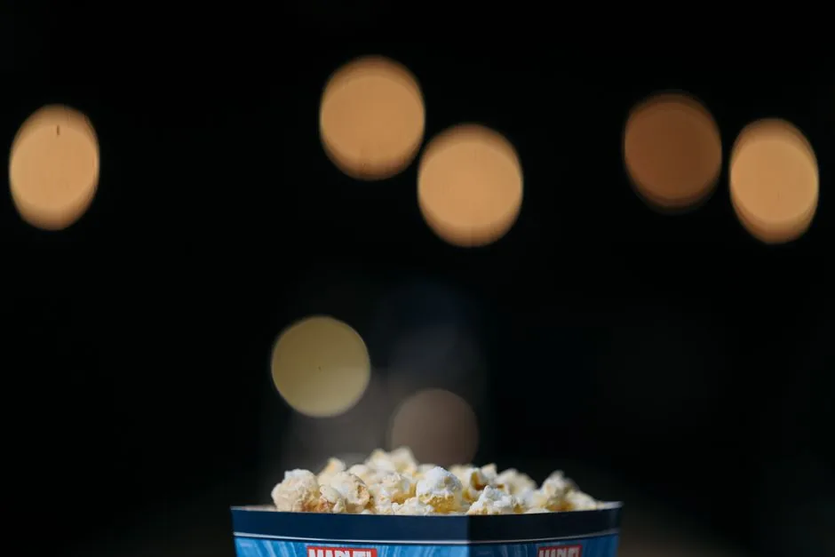 A cinema screen glowing before a film