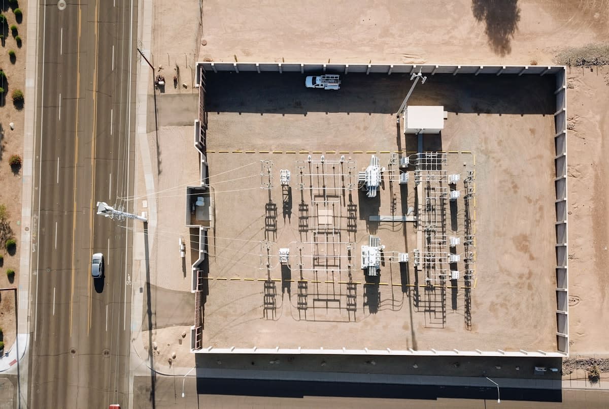 Aerial view of a sprawling power grid and data center