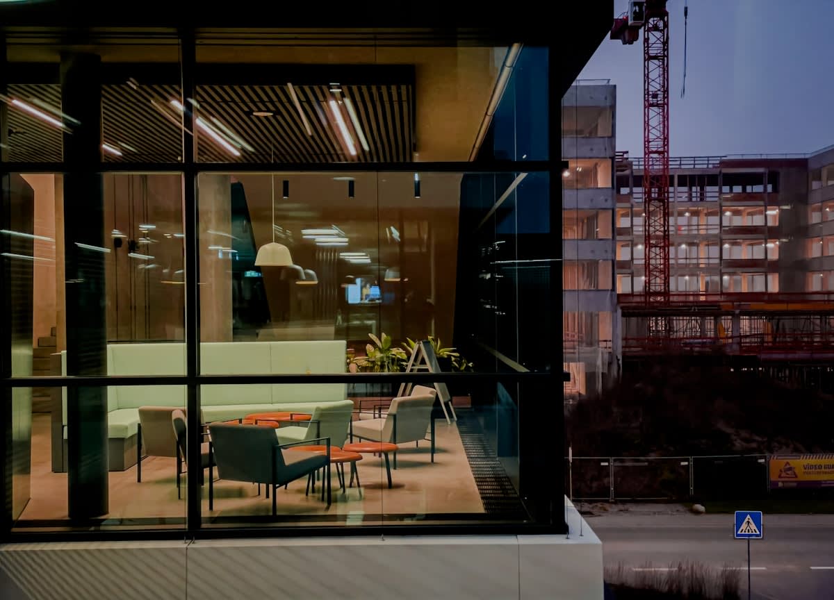 Modern corporate office with holographic AI interfaces