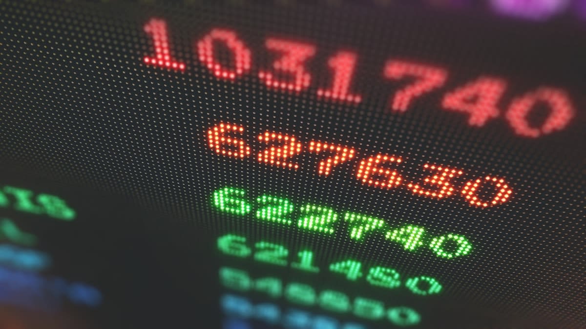 Global stock market ticker with green and red numbers