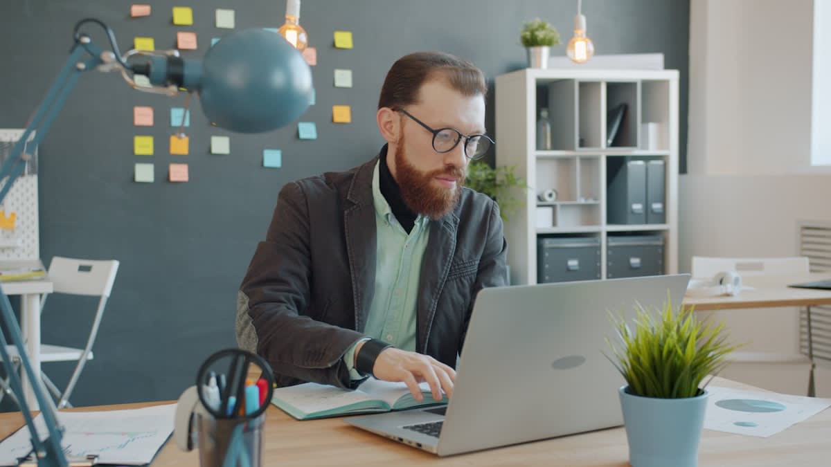 Modern professional working with AI interface in a high-tech office