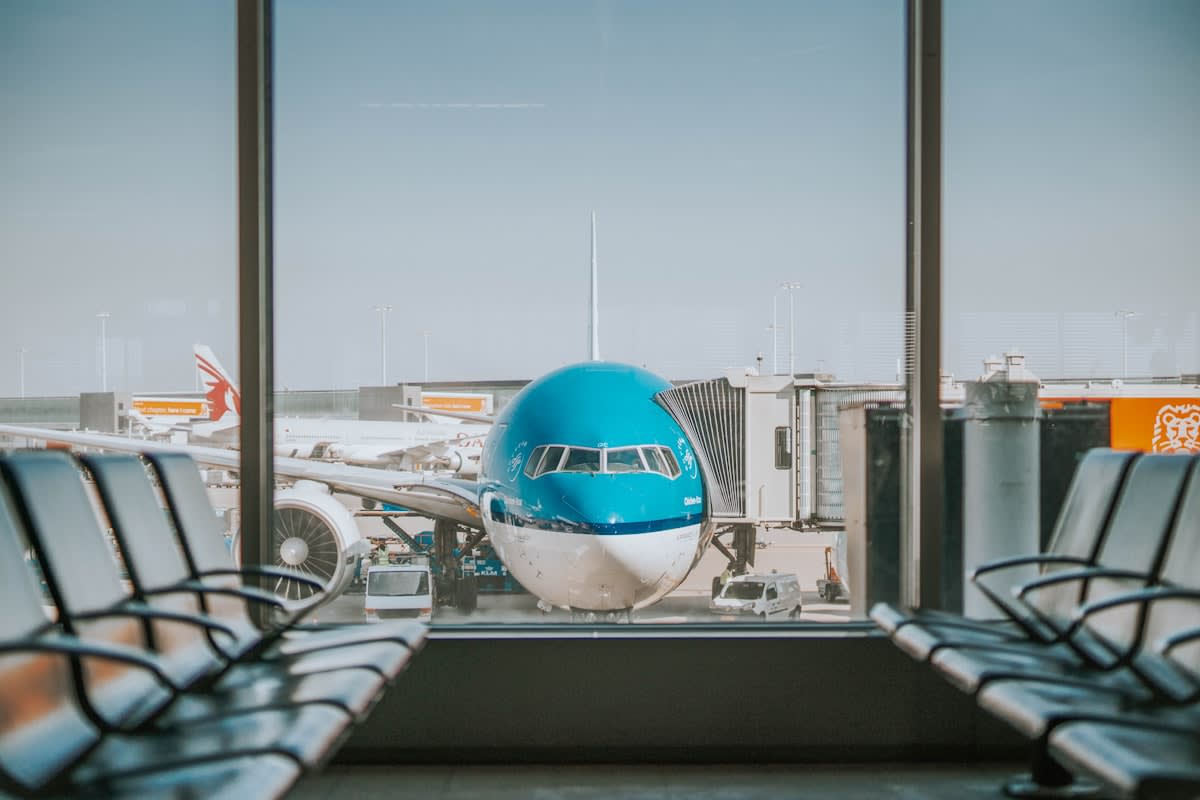 Commercial aircraft grounded at a modern airport terminal