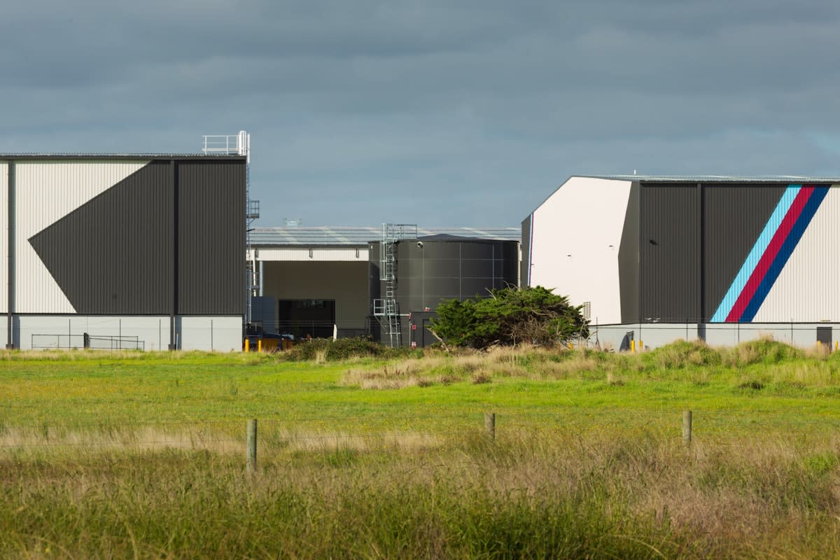 Industrial sodium-ion battery storage containers in a modern facility