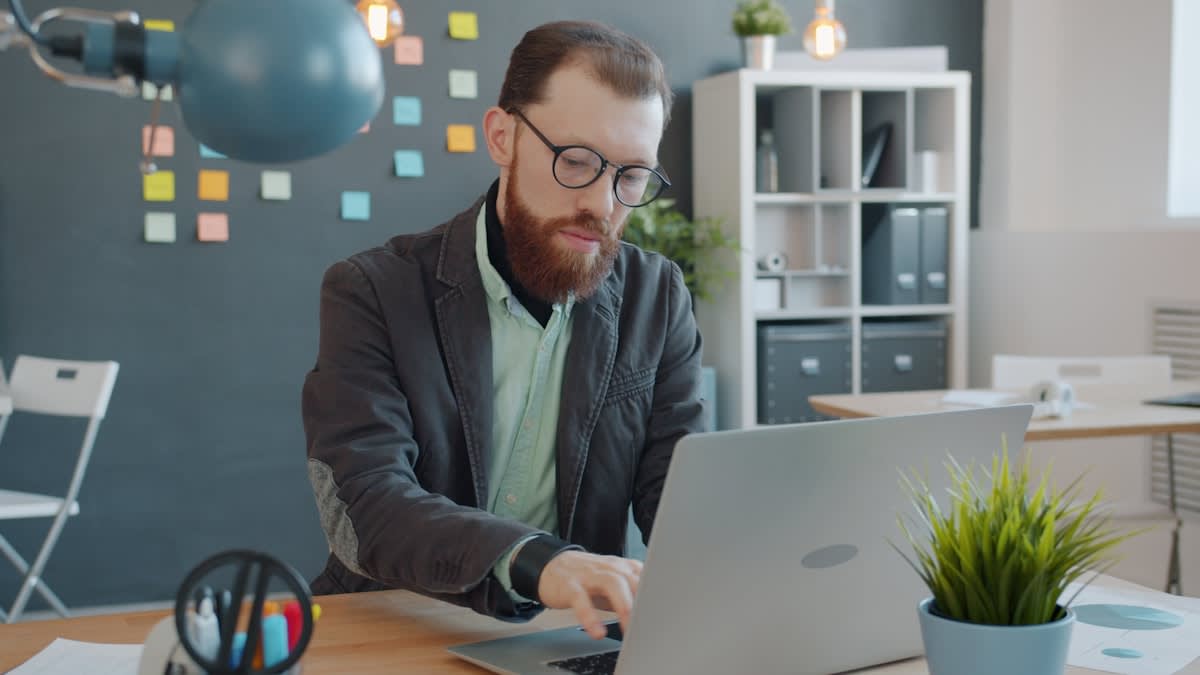 Professional using AI tools in a modern office