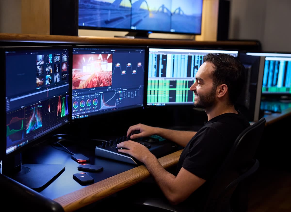 Modern professional working with multiple screens and AI interfaces