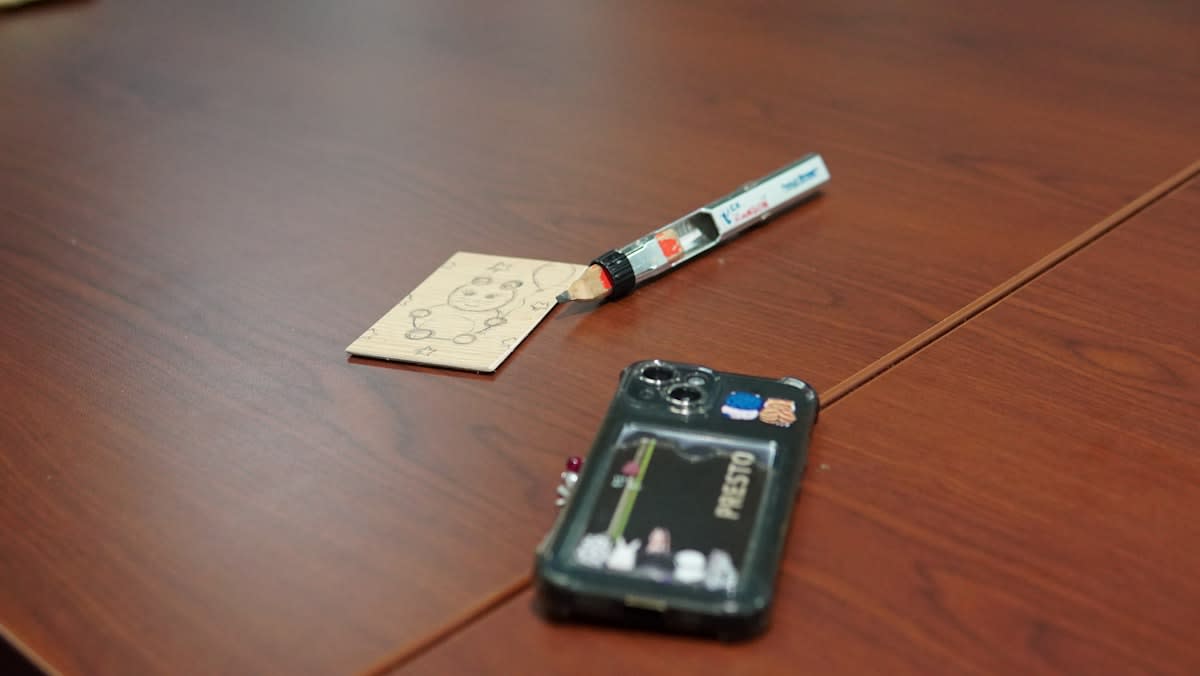 Close up of a credit card and a medical bill on a wooden table