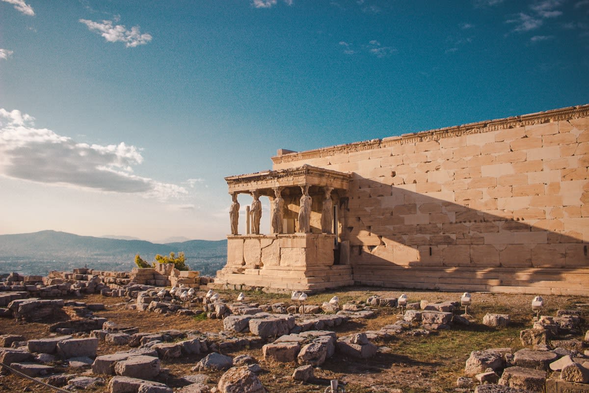 ancient greek ruins under sunset