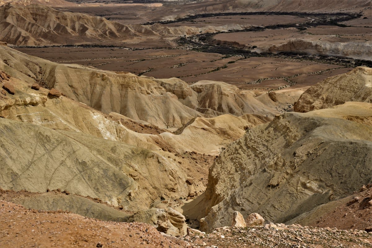 Industrial tailings piles in a desert landscape