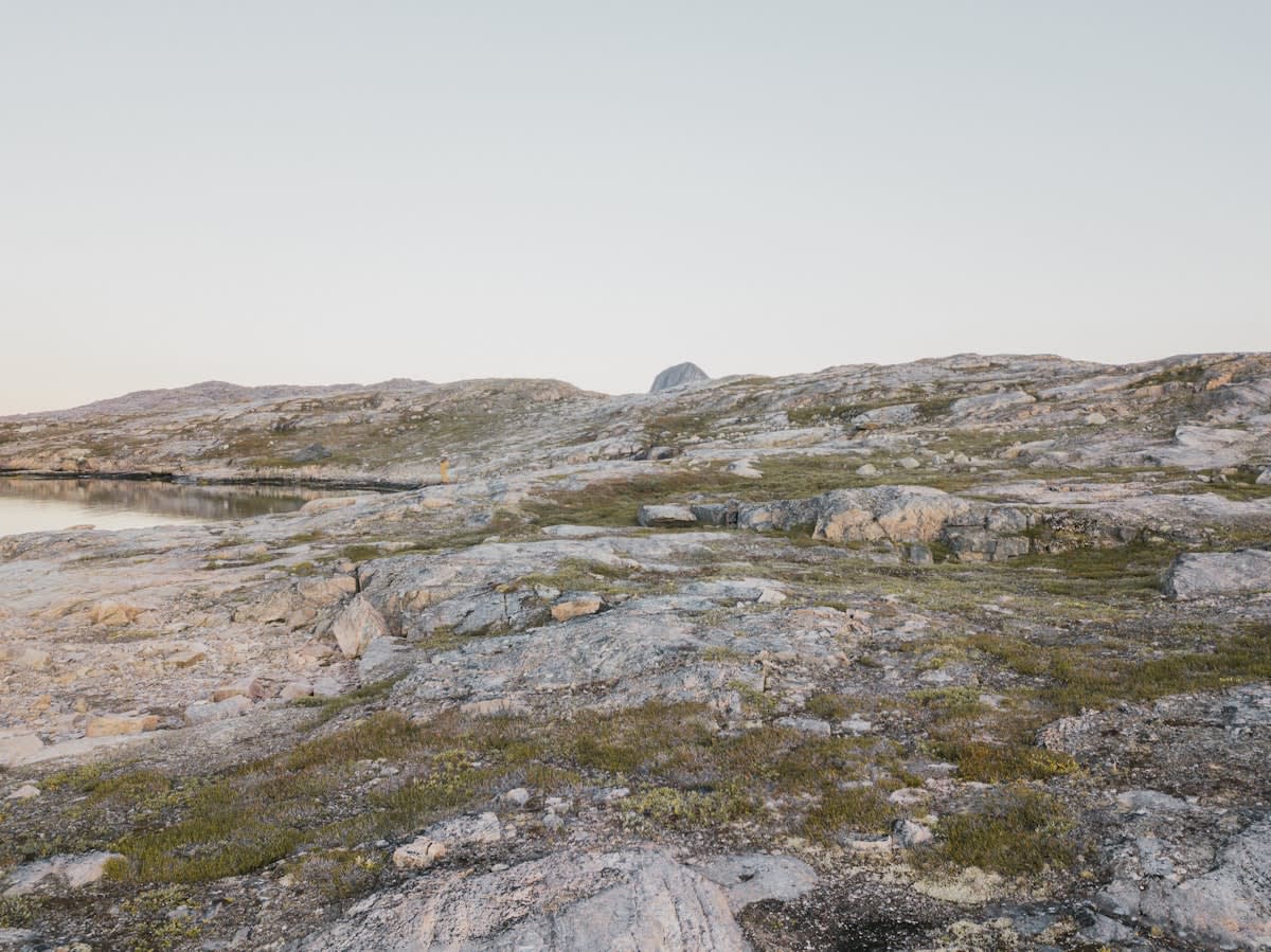 Mineral drilling rig in a rocky Greenland landscape