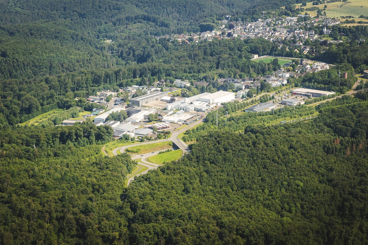 Aerial view of industrial park next to forest