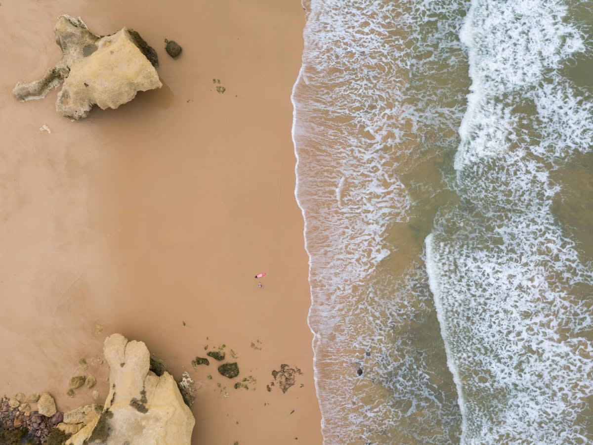 aerial view of plastic pollution on a beach