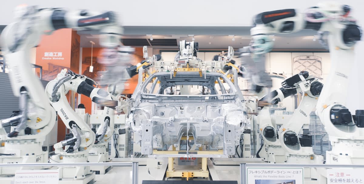 Humanoid robot working in an automotive assembly line
