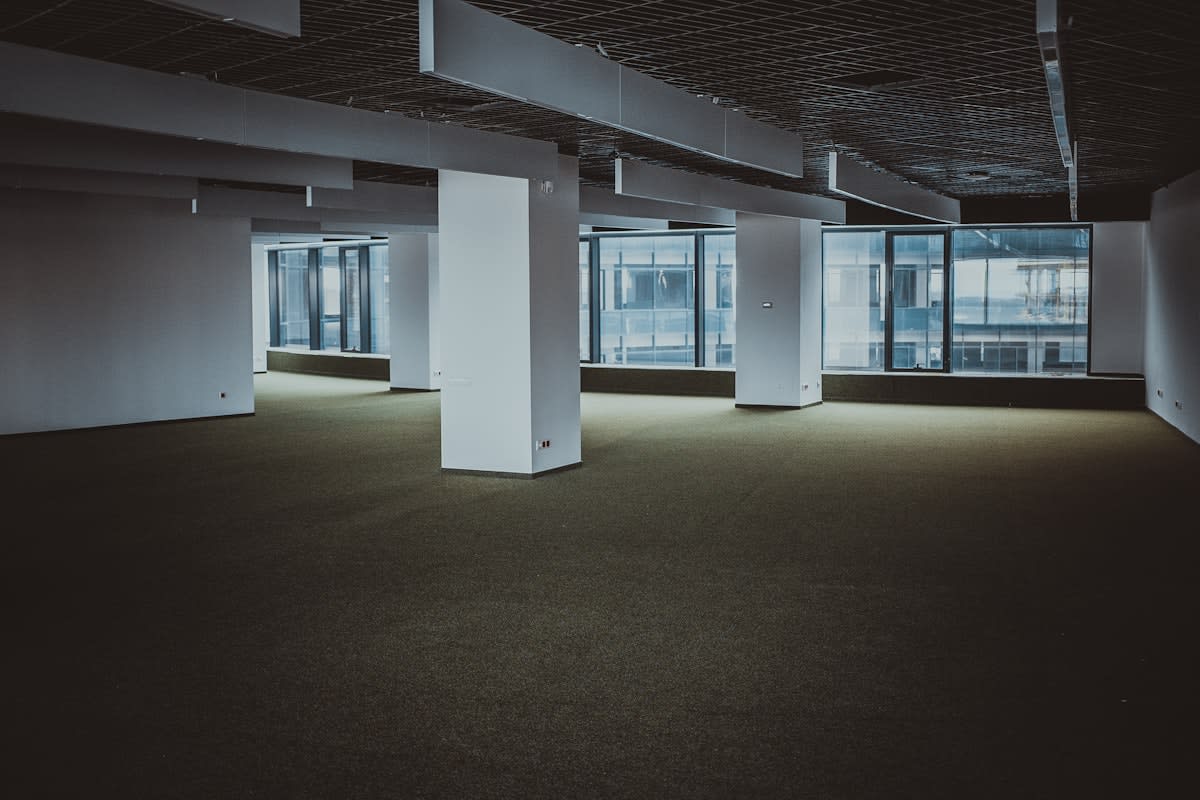 Empty office space with server racks in background
