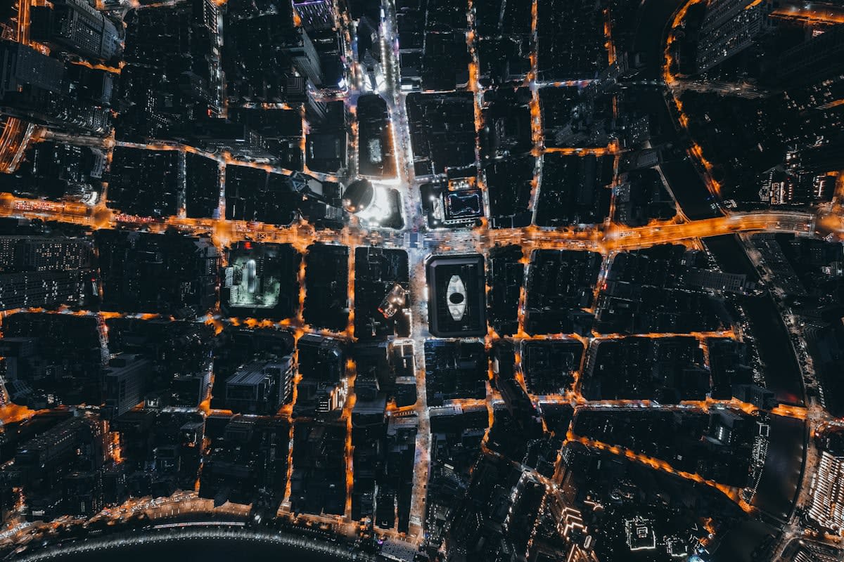 Aerial view of a dense city grid at night