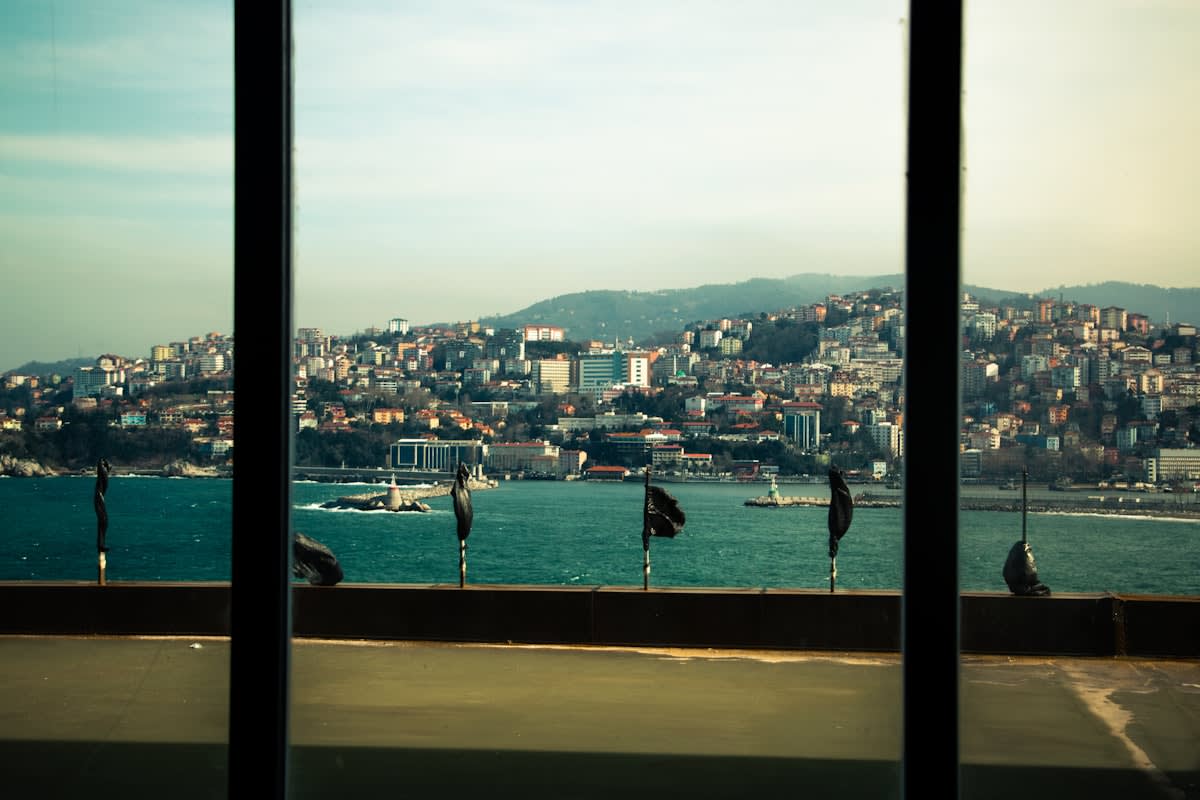 Modern digital nomad workspace with a view of a coastal city