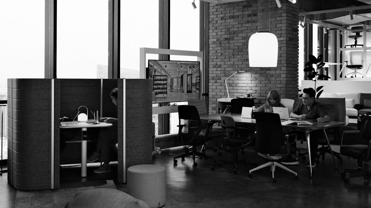 Modern minimalist open office with high tech screens