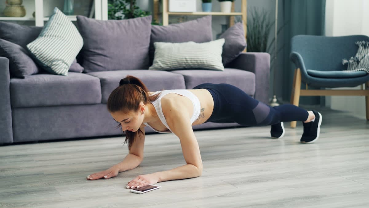 person performing a functional plank exercise
