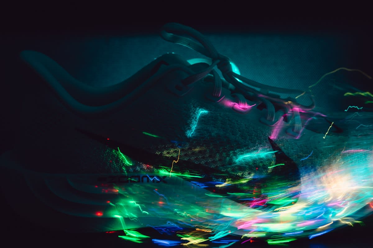 Brightly colored sneakers on a vibrant background