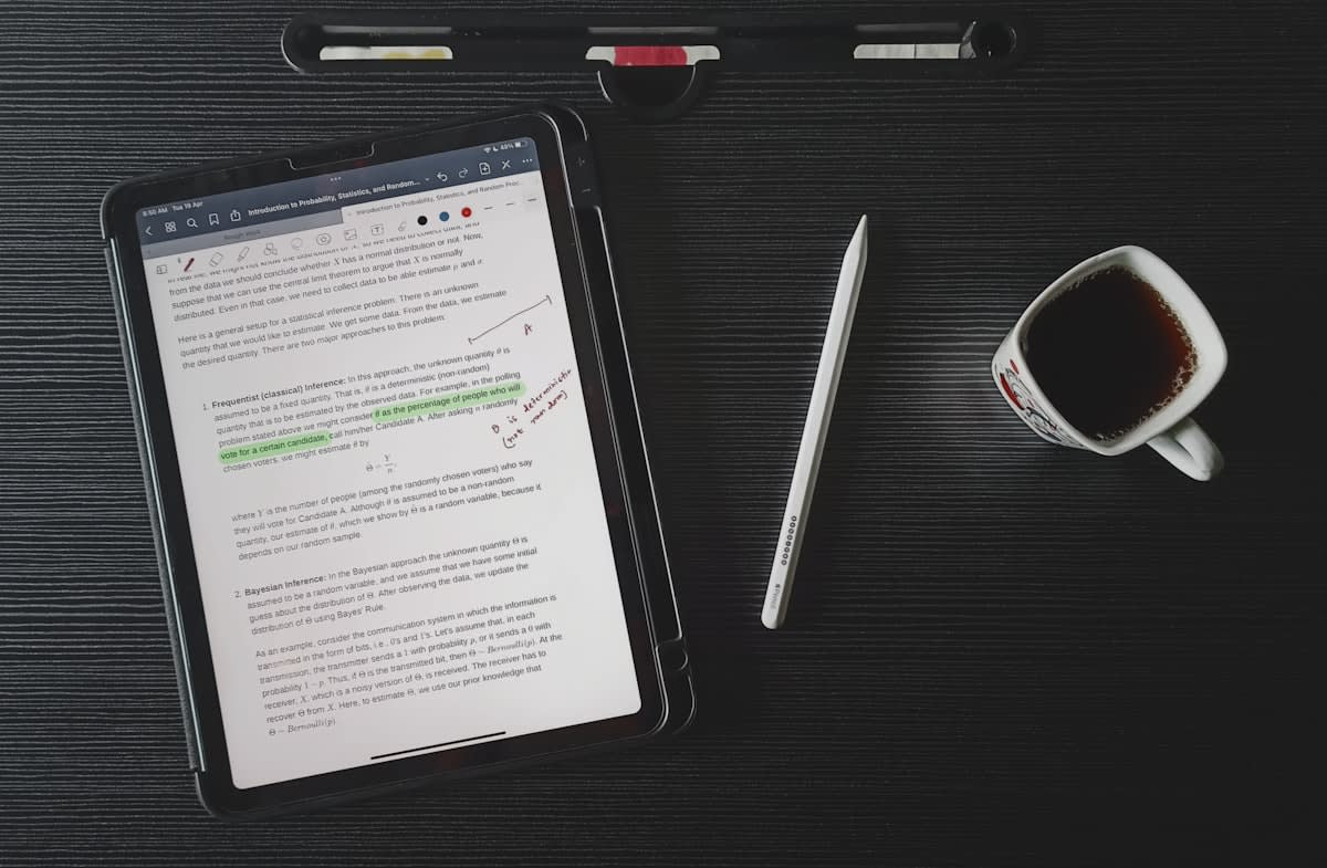 Close up of a legal contract and a digital tablet