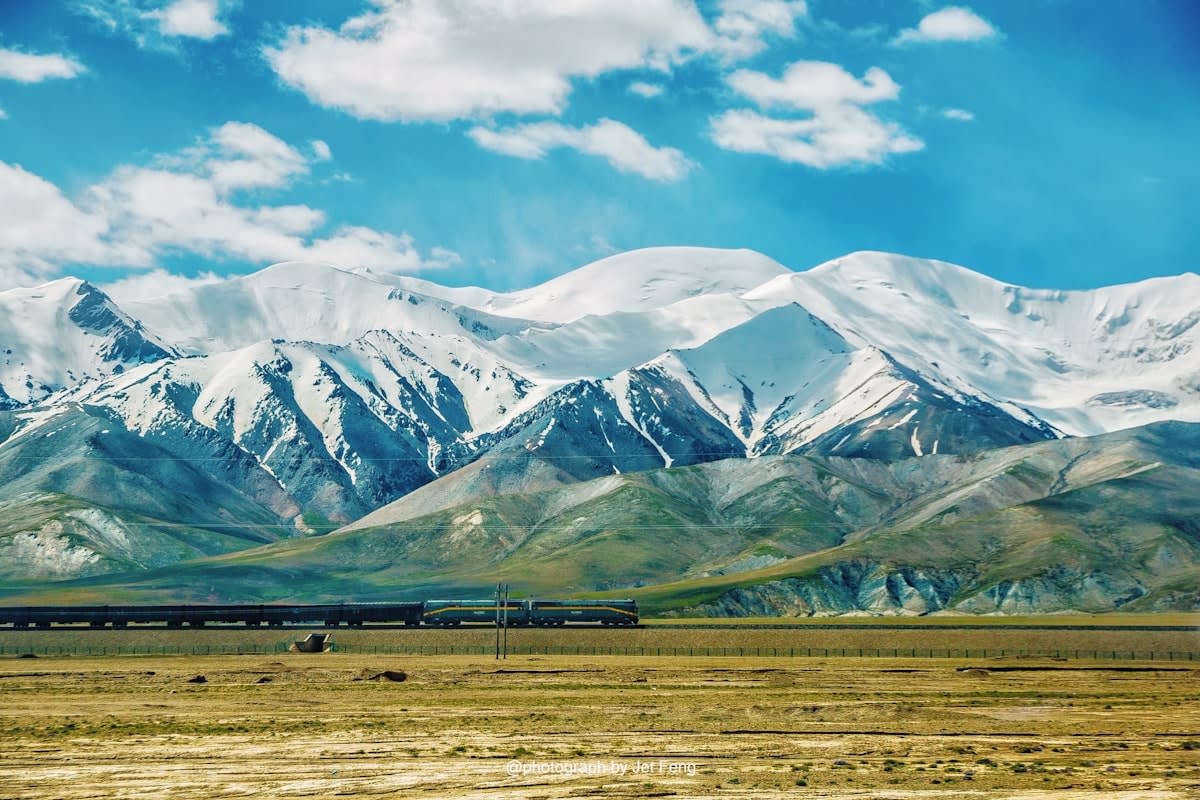 Central Asian nomad camp with mountains in background