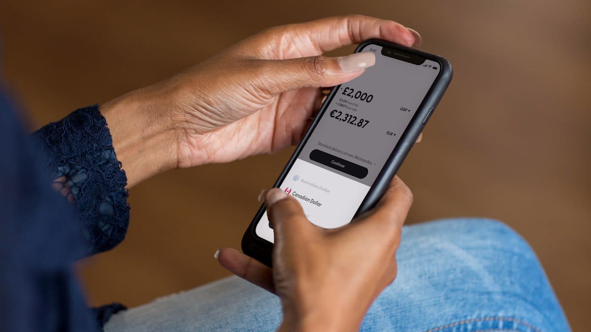 Close up of a smartphone screen showing a mobile money transaction