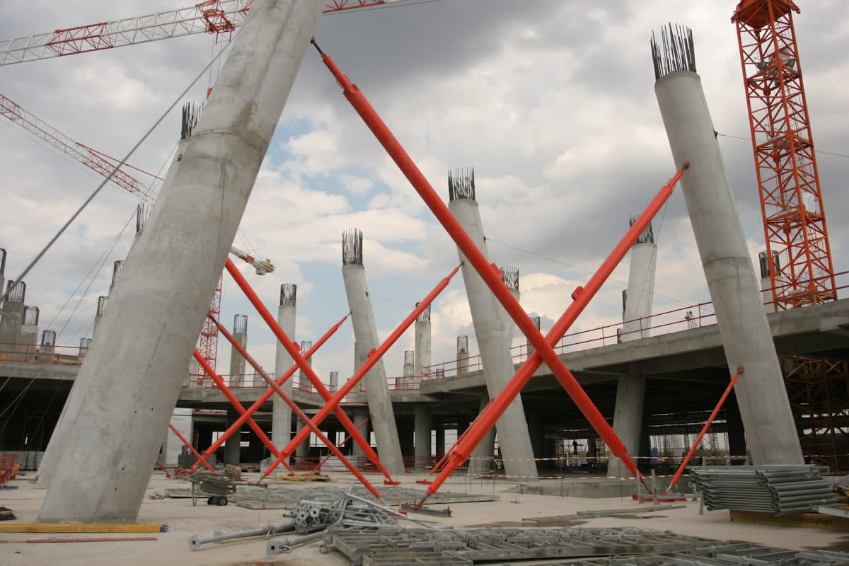 Massive construction site with cranes and concrete structures