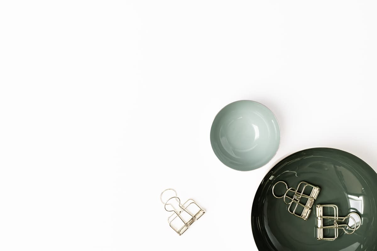 Minimalist luxury items on a white background