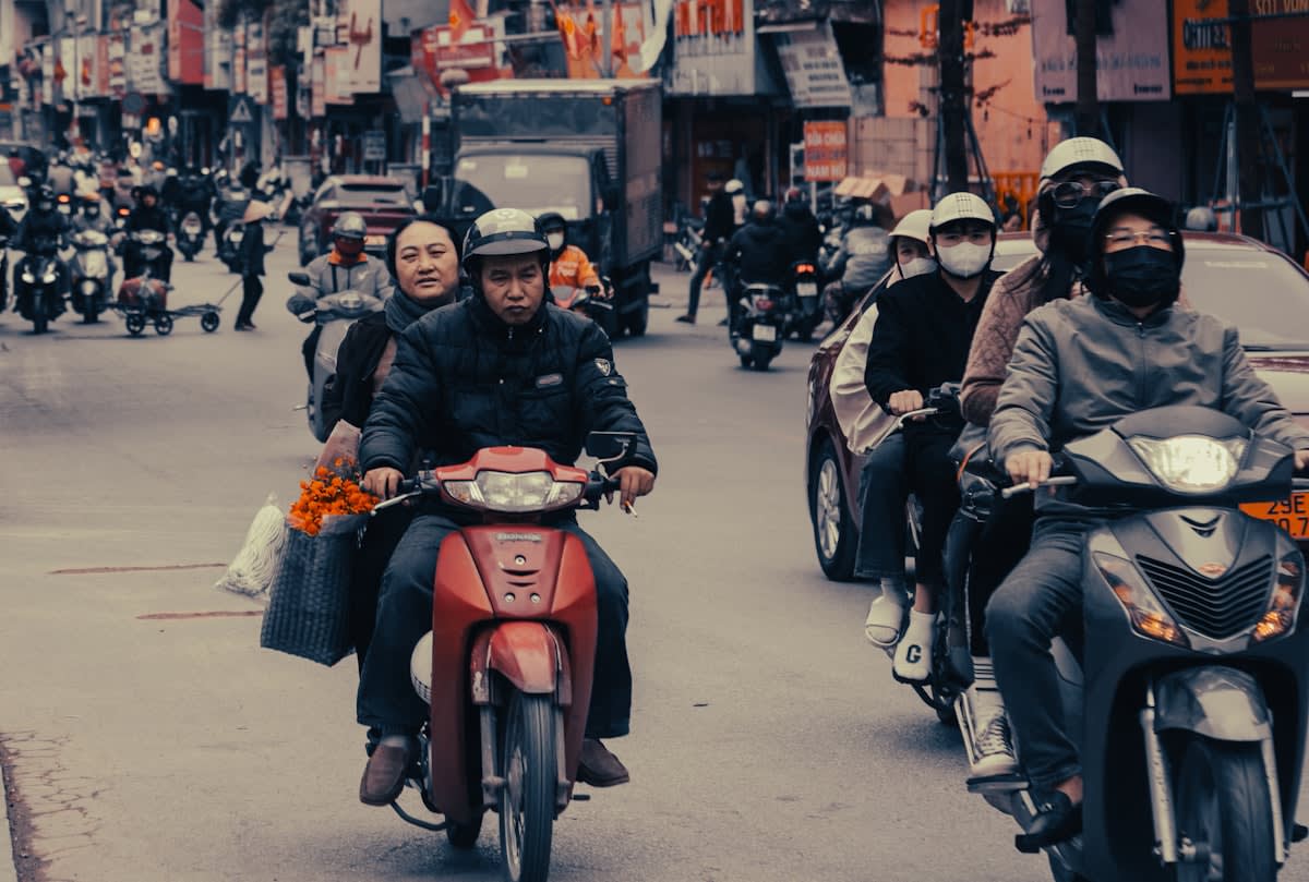 Motorbike delivery drivers in a dense city