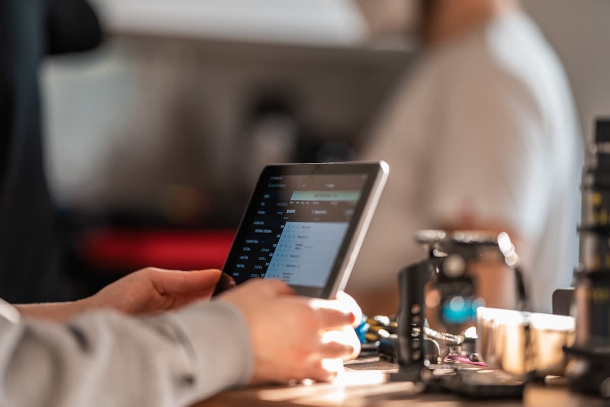 Medical professional analyzing glucose data on a tablet