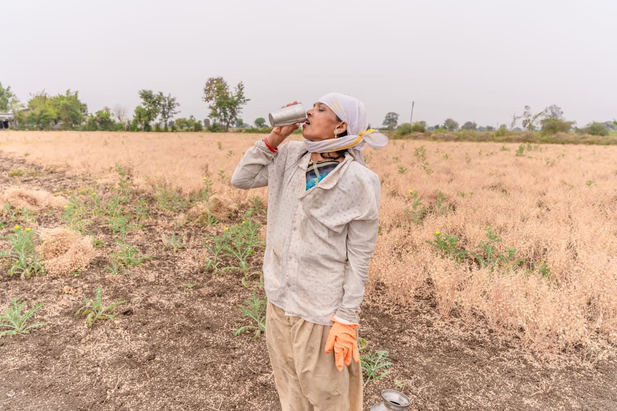 Field worker using a smartphone for data verification in rural India