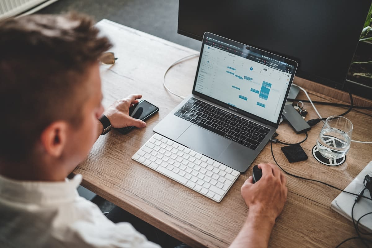 Person focusing at a clean desk with biometric data