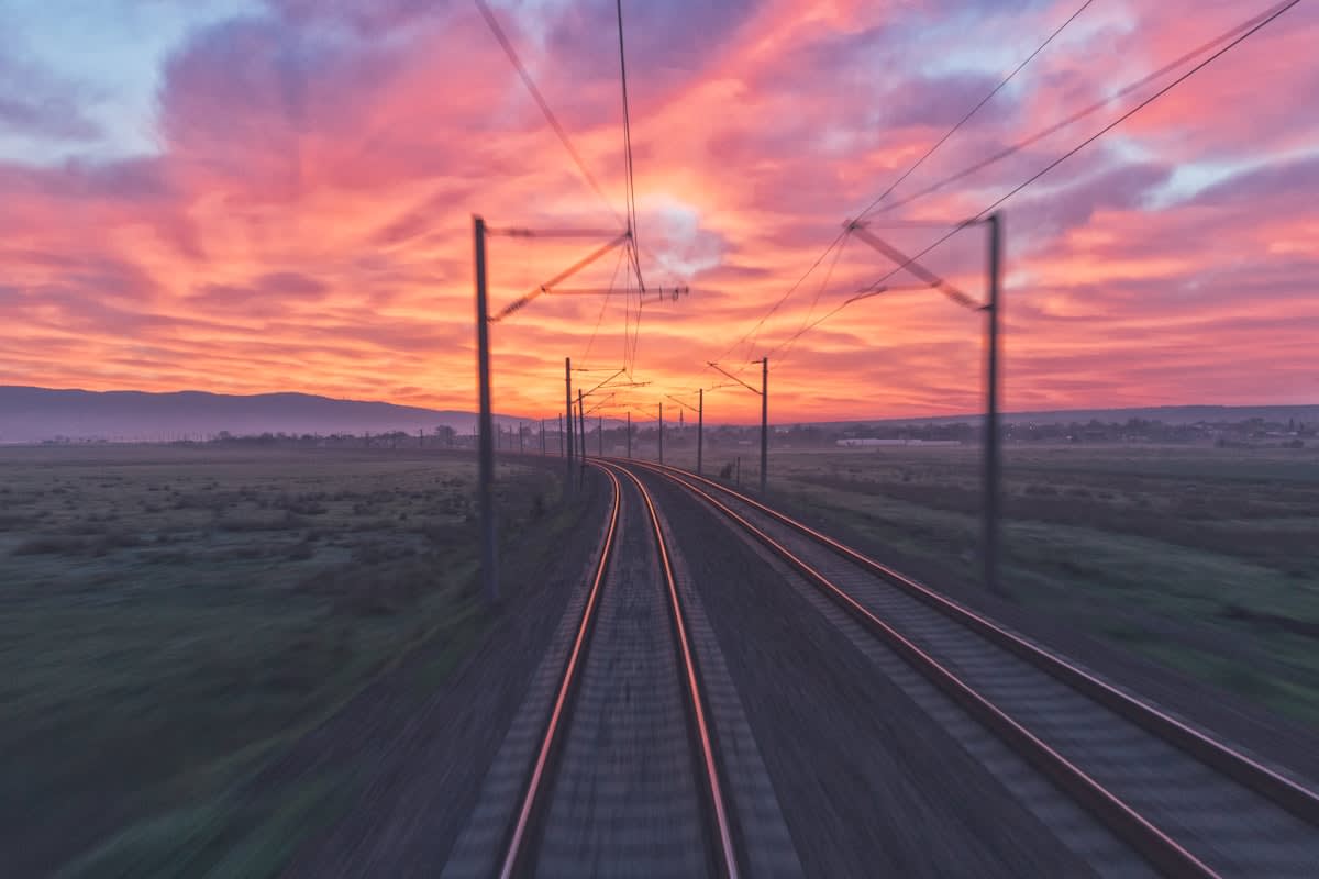 Train tracks stretching across a landscape