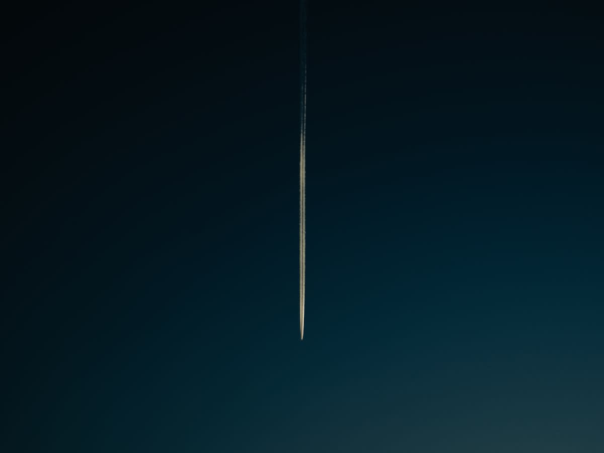 Rocket launch plume against a dark sky