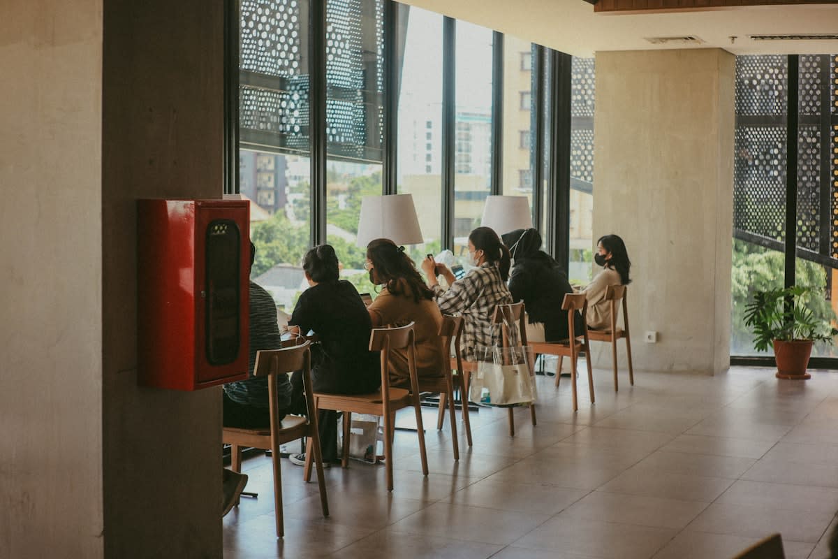Young adults gathering in a modern Jakarta cafe
