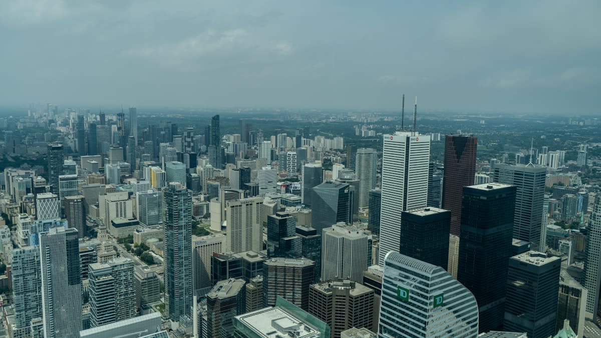 Aerial view of a modern Latin American city skyline with digital overlays