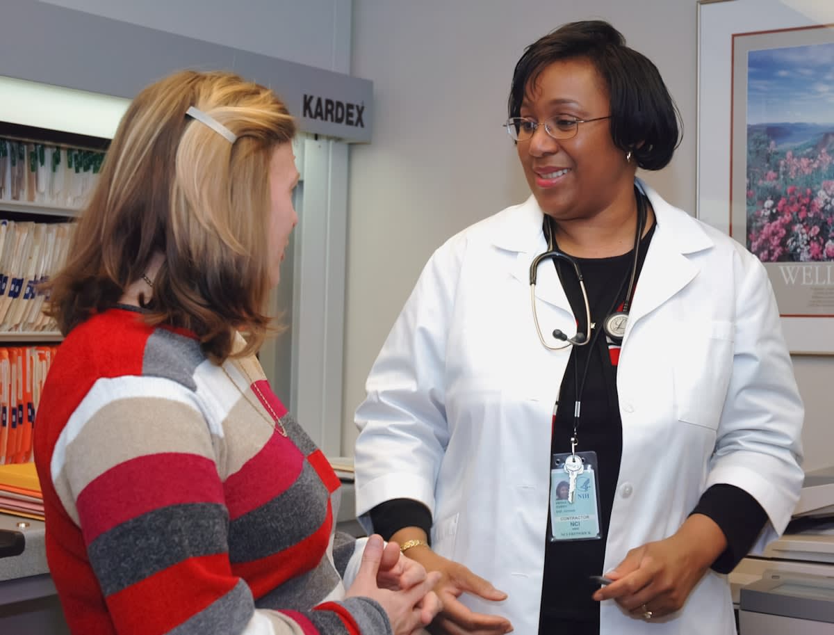Medical professional discussing data with an athlete