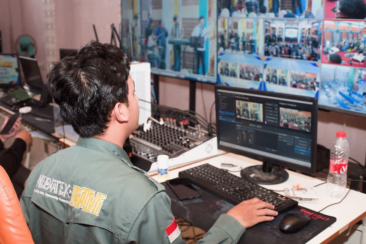 Industrial control room with multiple screens