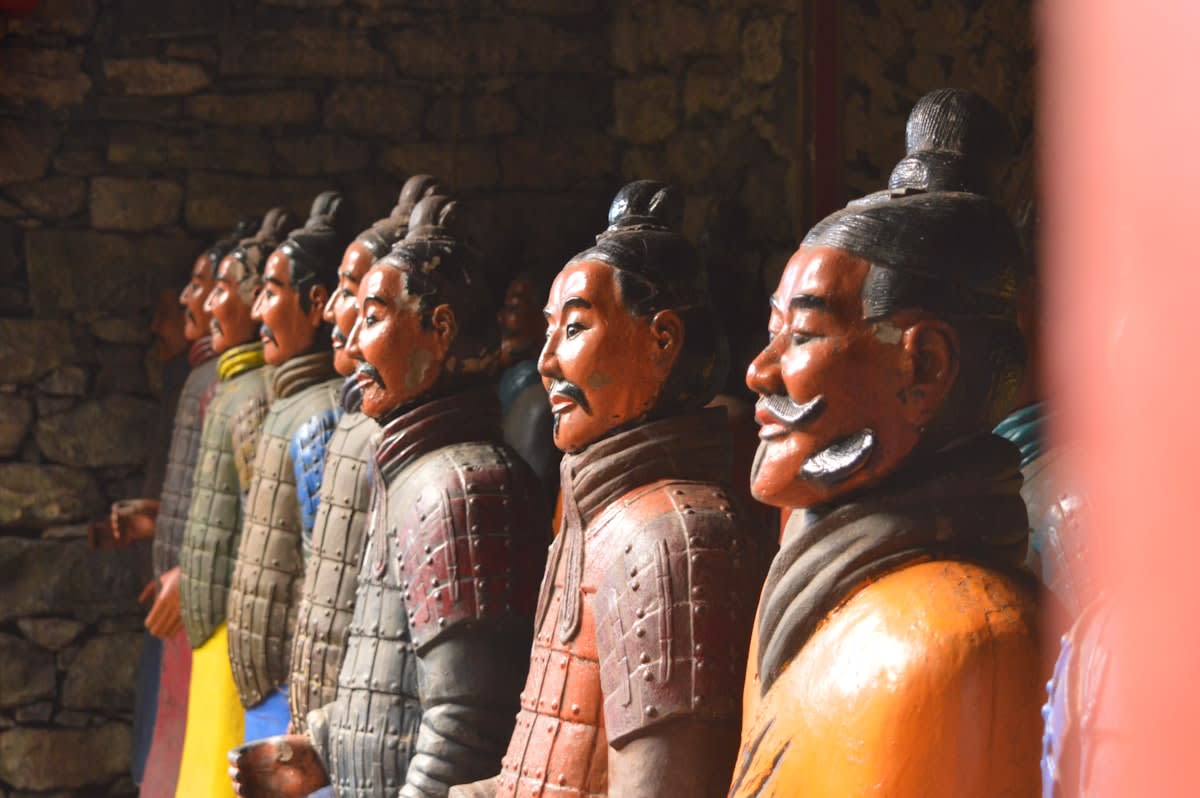 Ancient terracotta sculptures in a museum setting