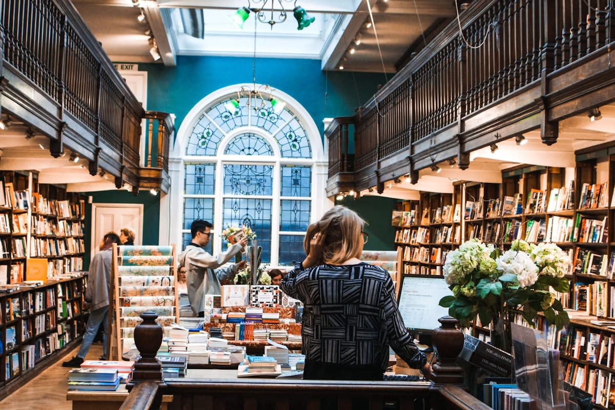 Cozy independent bookstore with people chatting